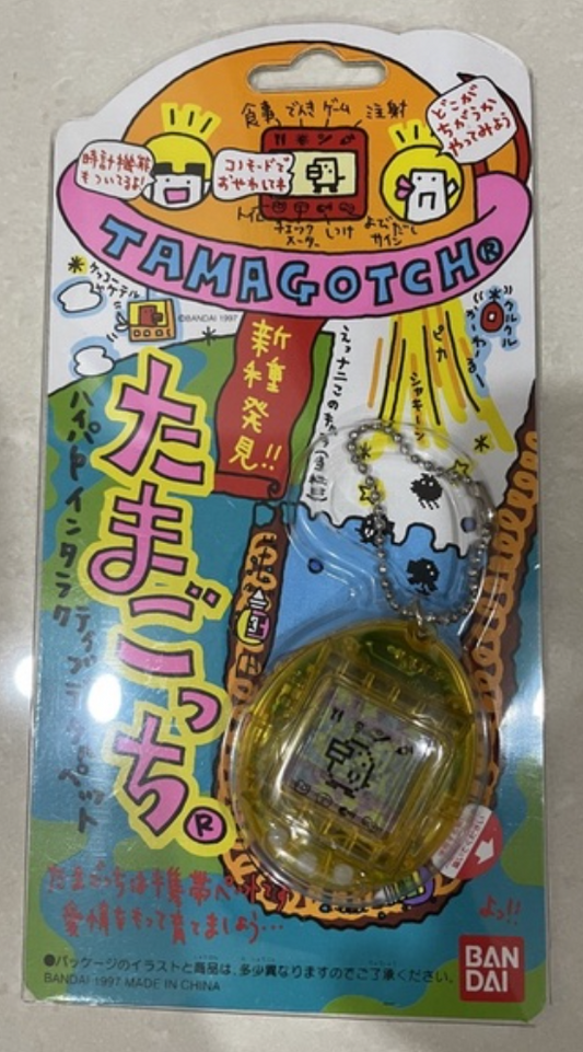 Bandai 1997 Tamagotchi LCD LSI Handheld Game Yellow Crystal ver