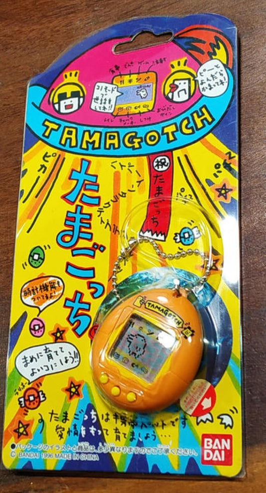 Bandai 1996 Tamagotchi LCD LSI Handheld Game Orange Yellow ver