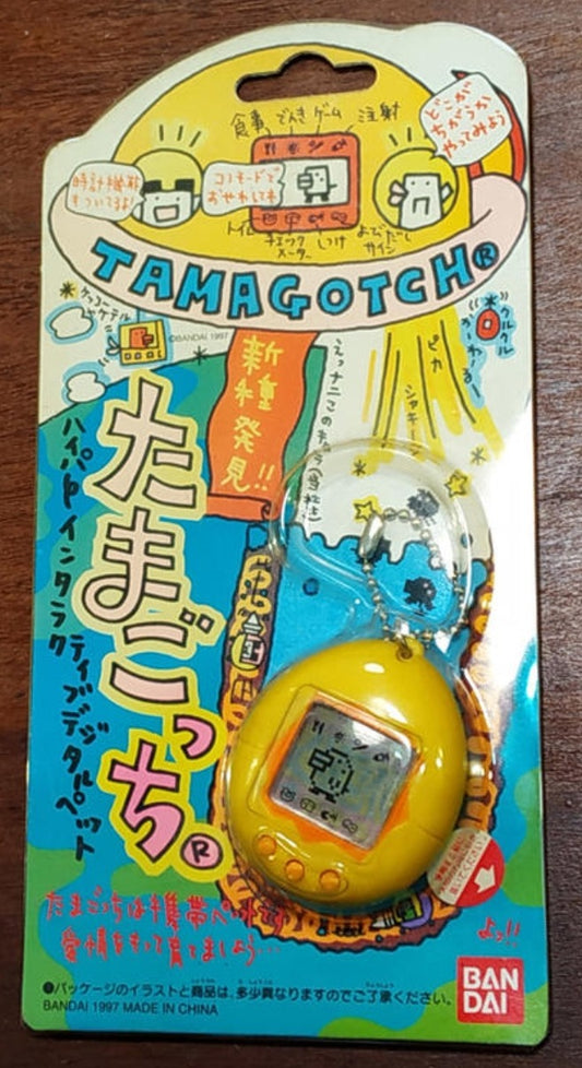 Bandai 1996 Tamagotchi LCD LSI Handheld Game Yellow Orange ver