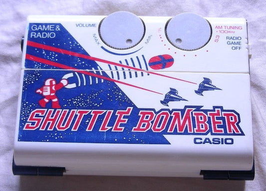 Casio 1983 CG-70 Shuttle Bomber Electronic Handheld Video LCD Game & Radio - Lavits Figure
 - 1